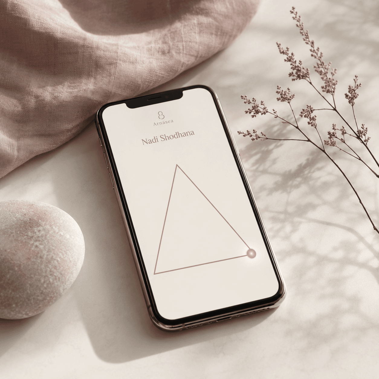 Calm setting, the Arnasea app on Nadi Shodhana on an iPhone, a soft triangle with a breath bead, gentle daylight.